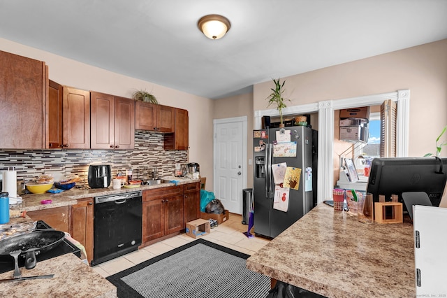 kitchen with light tile patterned floors, decorative backsplash, dishwasher, light countertops, and refrigerator with ice dispenser