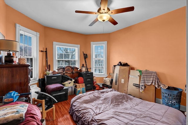 bedroom featuring ceiling fan and wood finished floors