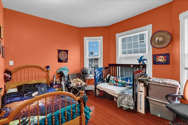 bedroom with wood finished floors