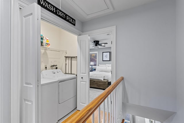 laundry room with light wood-style floors, laundry area, and separate washer and dryer