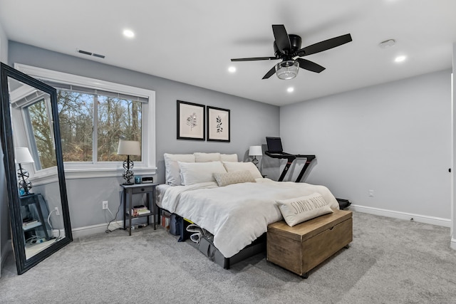 carpeted bedroom with a ceiling fan, recessed lighting, visible vents, and baseboards