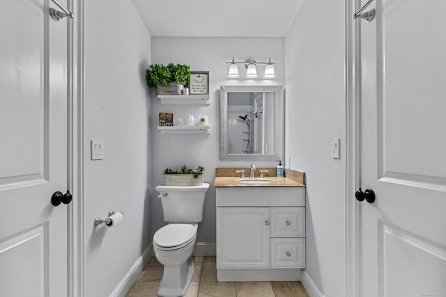 full bath with baseboards, a shower, toilet, tile patterned flooring, and vanity