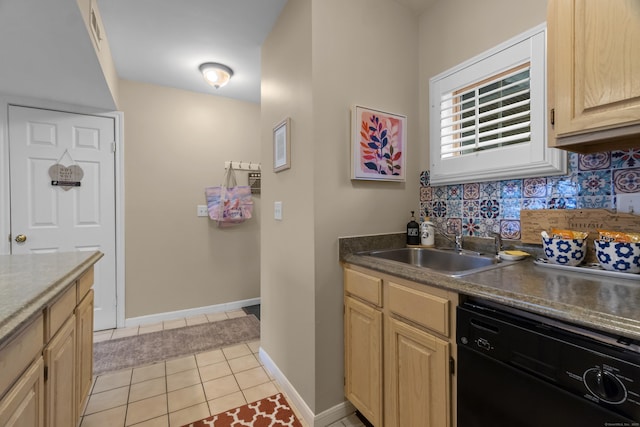 kitchen featuring light tile patterned floors, a sink, dishwasher, light brown cabinetry, and tasteful backsplash