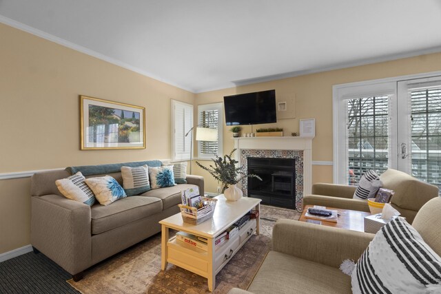 313 Old Pond Ln Unit 313, Norwich, CT 06360 - living room with plenty of natural light, crown molding, a glass covered fireplace, and baseboards