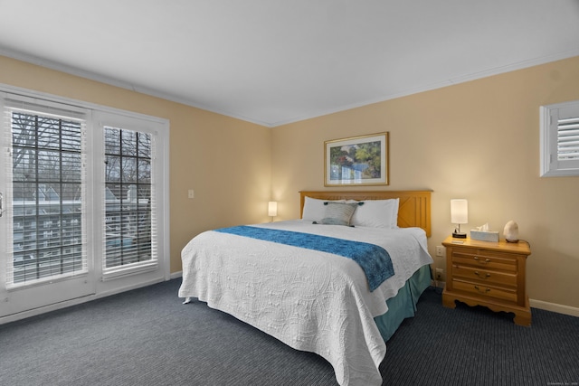 bedroom with carpet floors, ornamental molding, and baseboards