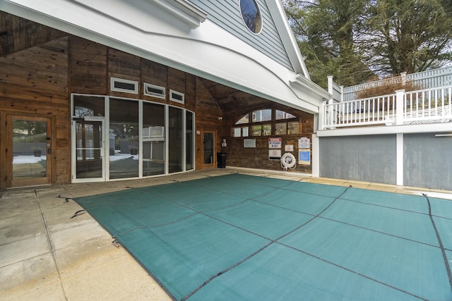 view of swimming pool featuring fence