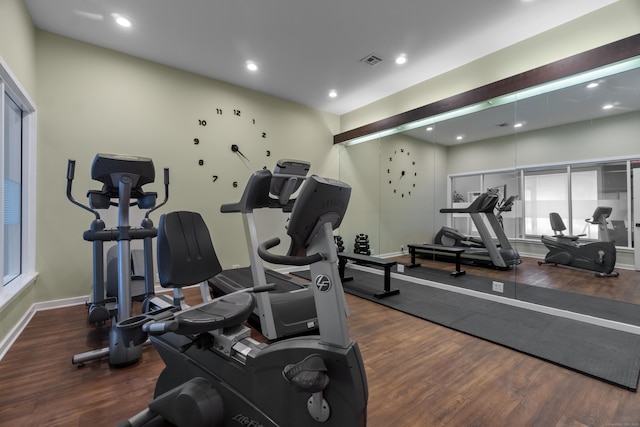 gym featuring baseboards, wood finished floors, visible vents, and recessed lighting