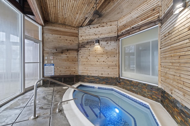 view of swimming pool with an indoor in ground hot tub