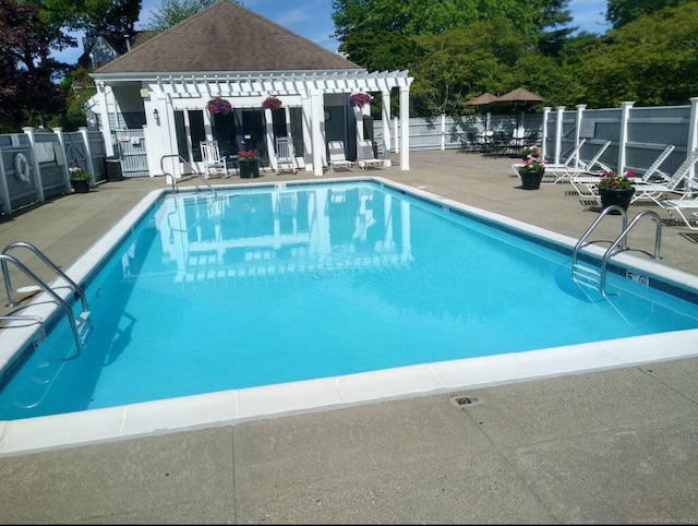 313 Old Pond Ln Unit 313, Norwich, CT 06360 - community pool featuring a pergola, fence, and a patio