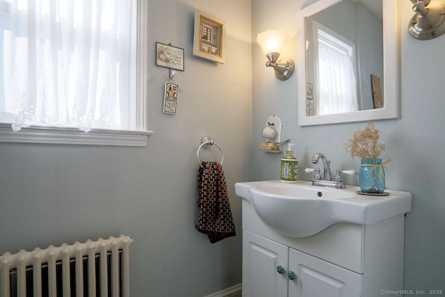 bathroom with vanity and radiator