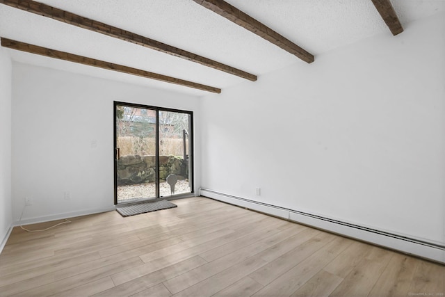 spare room featuring baseboards, baseboard heating, a textured ceiling, light wood-type flooring, and beam ceiling