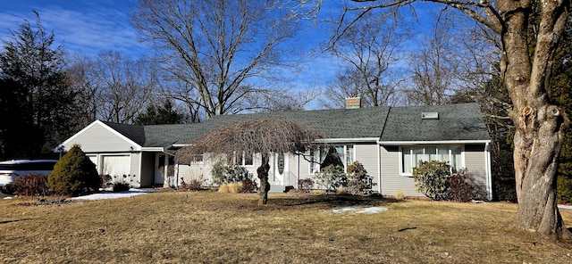 view of front facade featuring an attached garage, a shingled roof, a chimney, and a front lawn