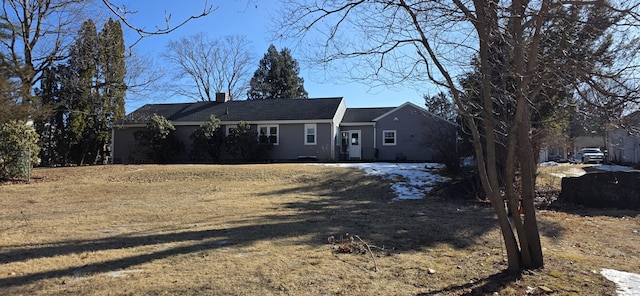 single story home with a chimney