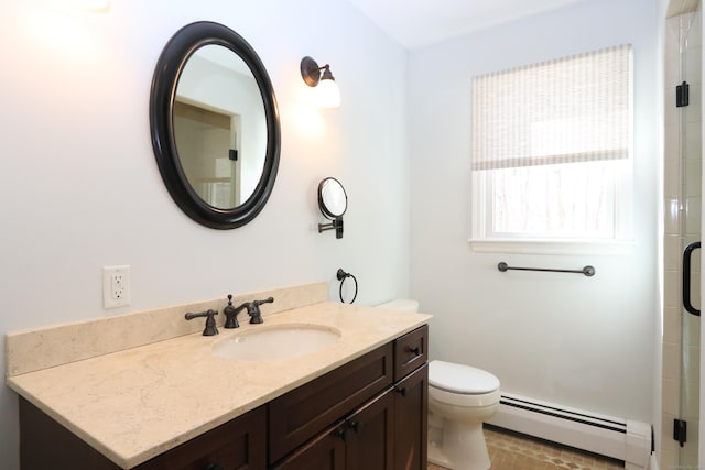 full bath with vanity, baseboard heating, a shower with shower door, and toilet