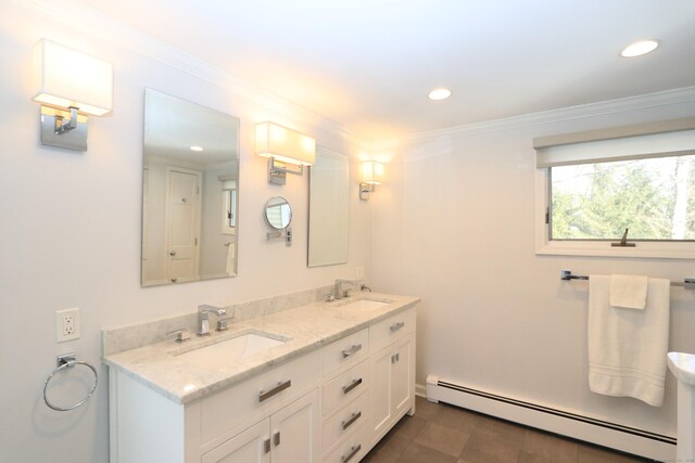 full bathroom with ornamental molding, baseboard heating, a sink, and recessed lighting