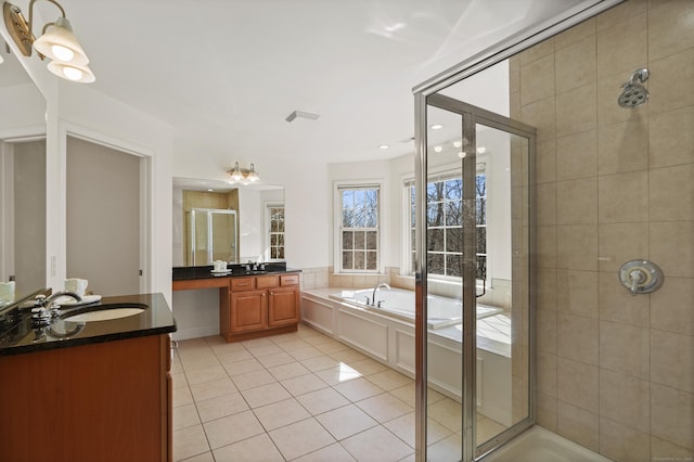 full bathroom with visible vents, tile patterned floors, vanity, a shower stall, and a bath