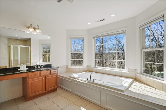 bathroom with a garden tub, visible vents, a stall shower, vanity, and tile patterned flooring