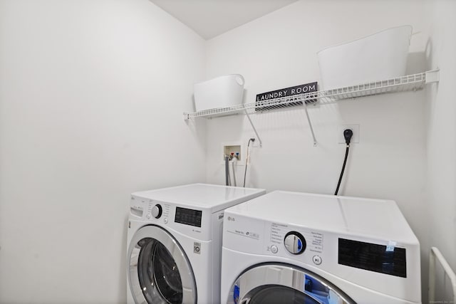 washroom with laundry area and washing machine and clothes dryer