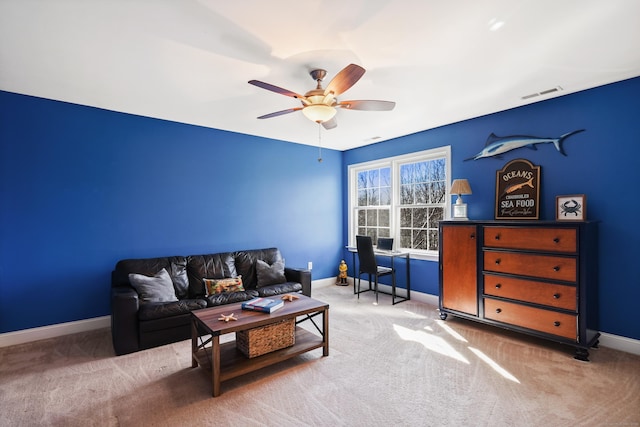 carpeted living room featuring visible vents, ceiling fan, and baseboards