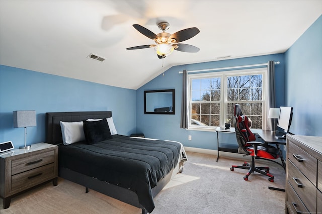 bedroom with ceiling fan, light carpet, visible vents, baseboards, and vaulted ceiling