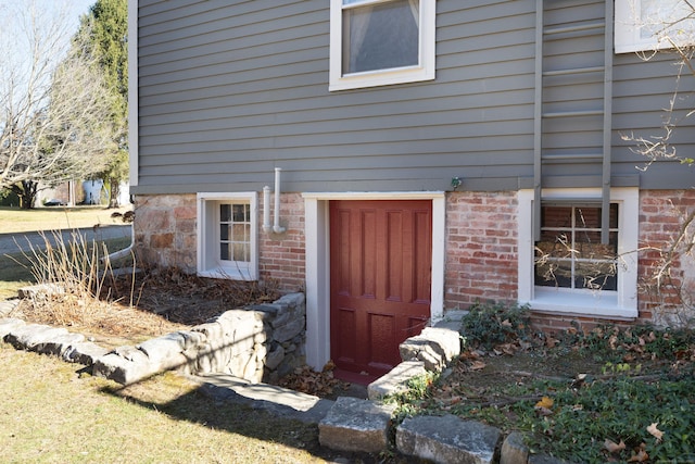 entrance to property with brick siding