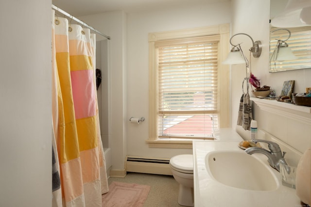 full bath featuring shower / bath combo, a baseboard radiator, a sink, and toilet