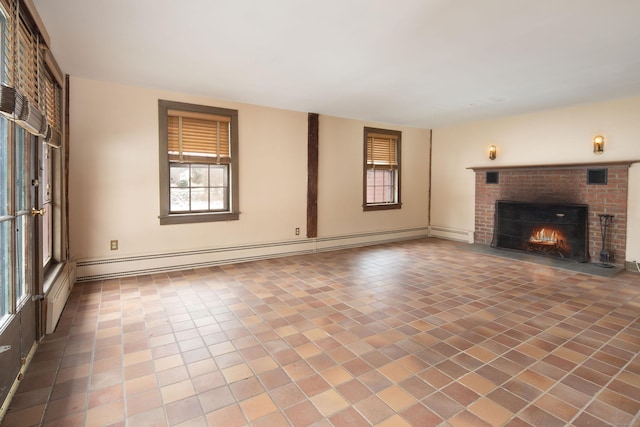 unfurnished living room with baseboard heating, a brick fireplace, and tile patterned flooring