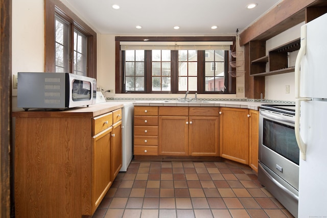 kitchen featuring stainless steel appliances, recessed lighting, plenty of natural light, and open shelves