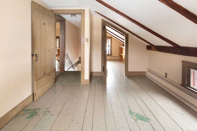 bonus room featuring lofted ceiling with beams, light wood-style flooring, and a baseboard heating unit