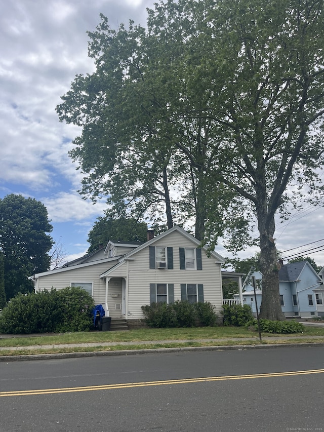 view of front of house with a chimney and an attached garage