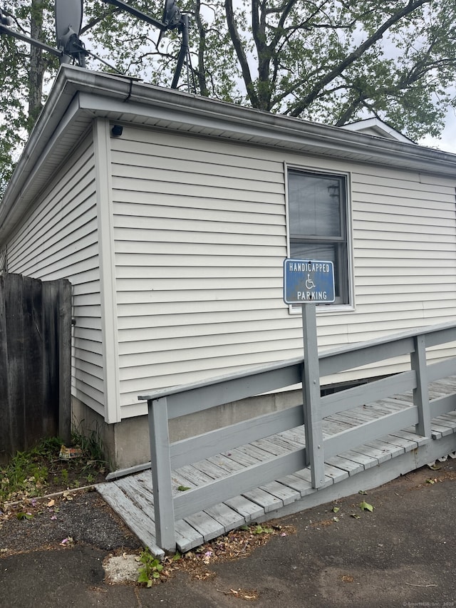 view of home's exterior featuring fence