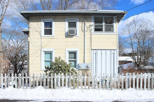 view of front of house featuring a fenced front yard and cooling unit