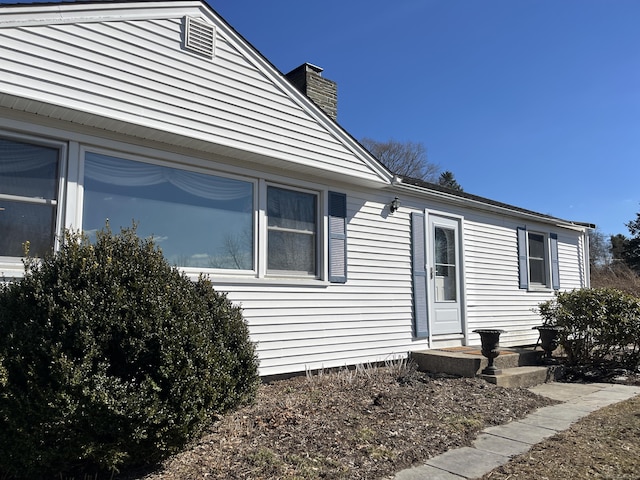 view of front of home with a chimney