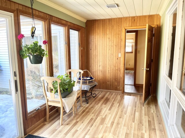 sunroom / solarium featuring wooden ceiling