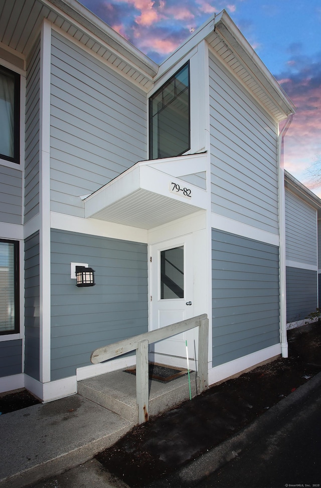 view of property exterior at dusk