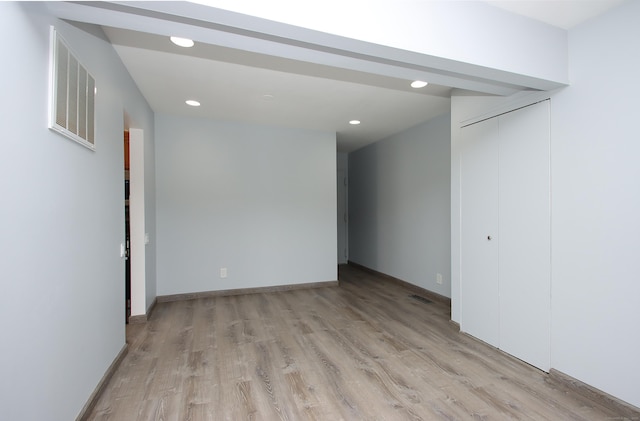 spare room with baseboards, recessed lighting, visible vents, and light wood-style floors