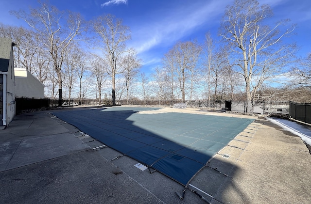 view of pool featuring a patio area, fence, and a fenced in pool