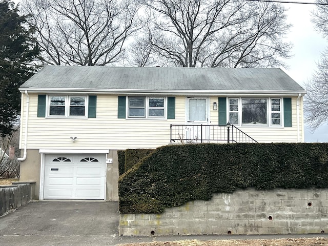 single story home with a garage and driveway