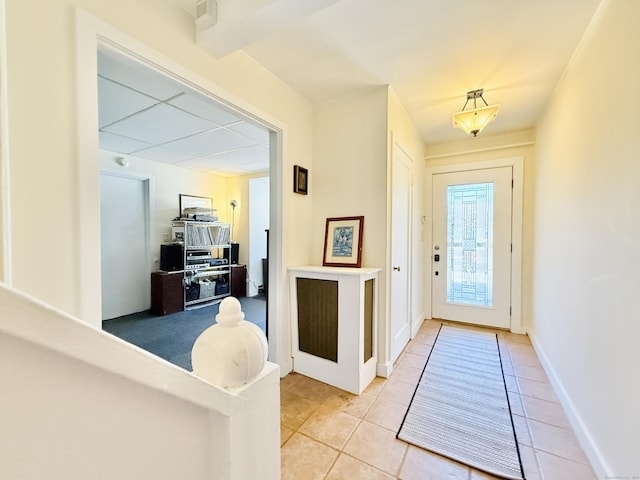 interior space with light tile patterned floors and baseboards