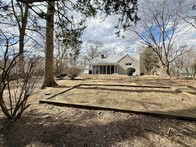 exterior space featuring a sunroom