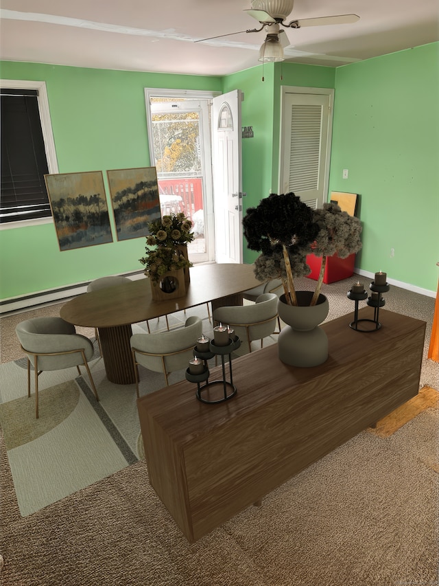 dining space with carpet flooring, a ceiling fan, and baseboards