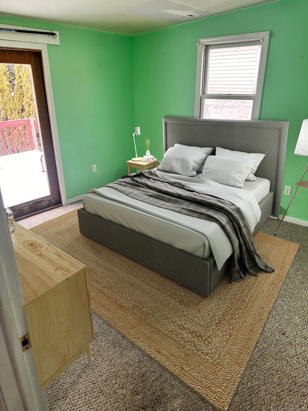 bedroom featuring access to exterior, carpet, and baseboards