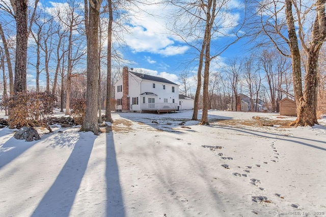 view of front of home featuring a chimney