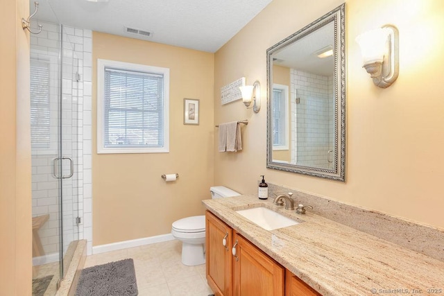 full bathroom with toilet, a stall shower, vanity, tile patterned flooring, and baseboards