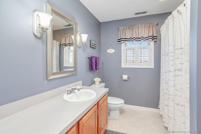 full bathroom featuring tile patterned flooring, visible vents, a textured ceiling, and vanity