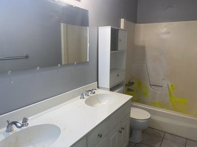 full bathroom with tile patterned flooring, a sink, toilet, and double vanity