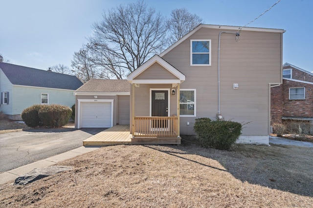 view of front of property with an attached garage and aphalt driveway