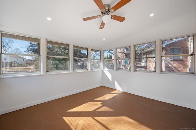 unfurnished sunroom with lofted ceiling and ceiling fan