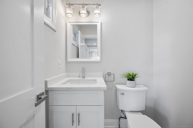 bathroom with toilet and vanity