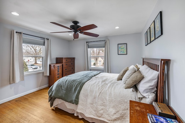 bedroom with baseboards, recessed lighting, a ceiling fan, and light wood-style floors